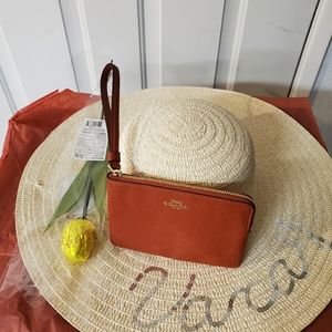 Coach wallet and a hat a rose